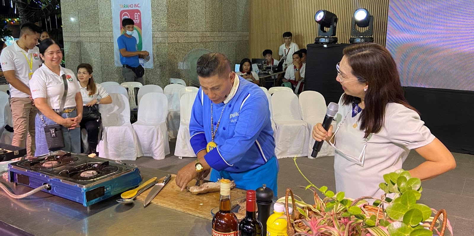 Tarlac City Mayor Cristy Angeles joined Chef Boy Logro (in blue) as he demonstrated three ways to cook rabbit meat.