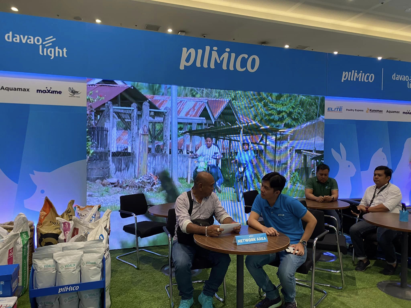 Pilmico representative and a customer at the Davao Agri Trade Expo